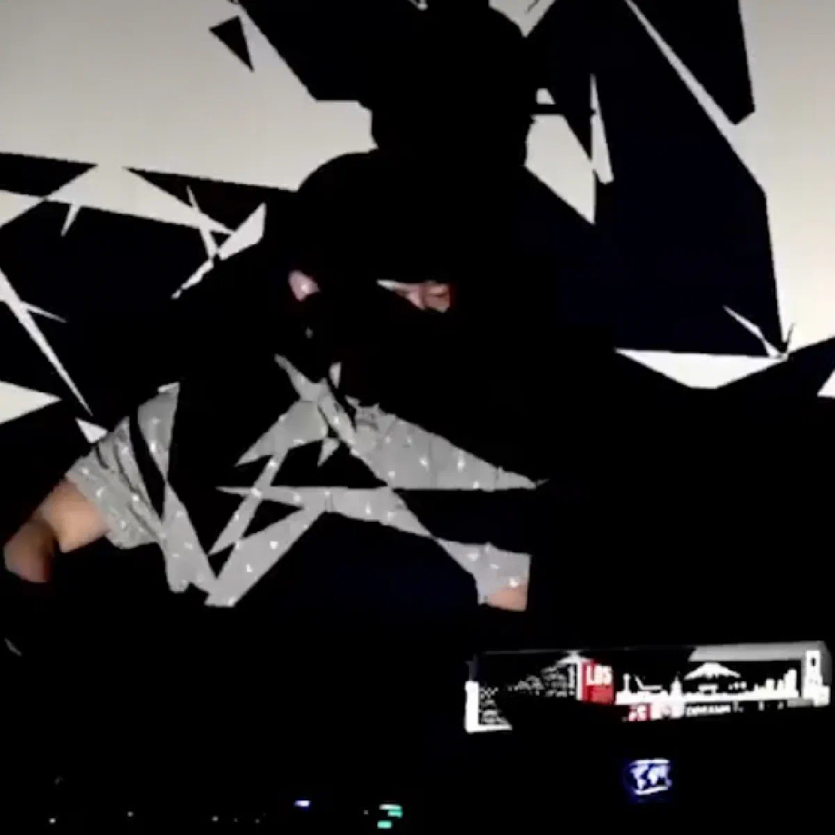 Abstract headshot showing Rook with projections on his head and a table with electronic beat-making tools.  